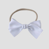 Sustainable recycled polyester matte satin bow headband for newborns to toddlers in white