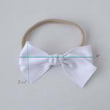 Sustainable recycled polyester matte satin bow headband for newborns to toddlers in white