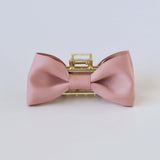 Dusty rose matte satin bow claw clip with gold clasp – elegant hair accessory for women and girls.