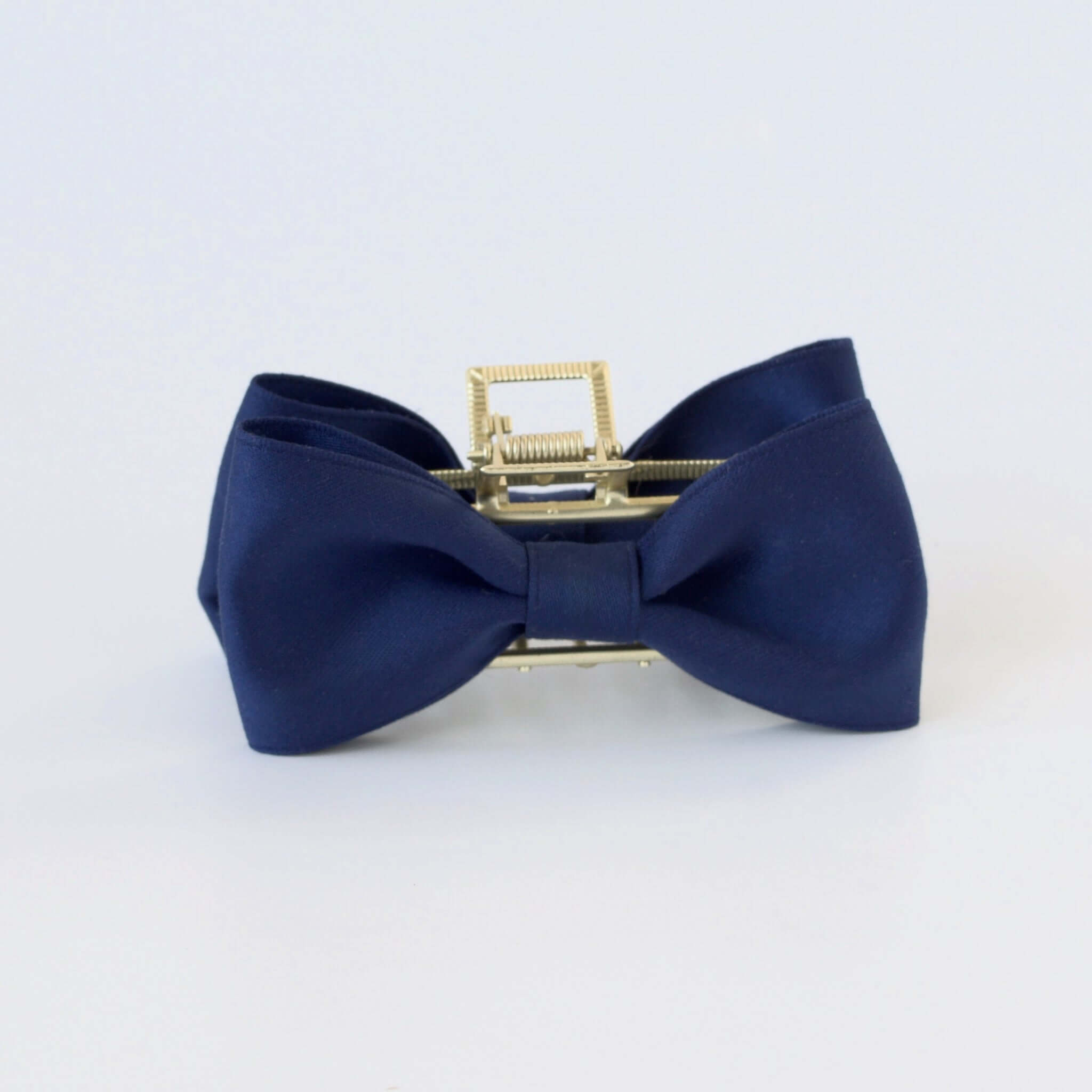 Black recycled matte satin bow claw clip with gold clasp – elegant hair accessory for women and girls.