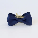 Black recycled matte satin bow claw clip with gold clasp – elegant hair accessory for women and girls.