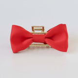 Red satin bow claw clip with gold clasp – elegant hair accessory for women and girls.