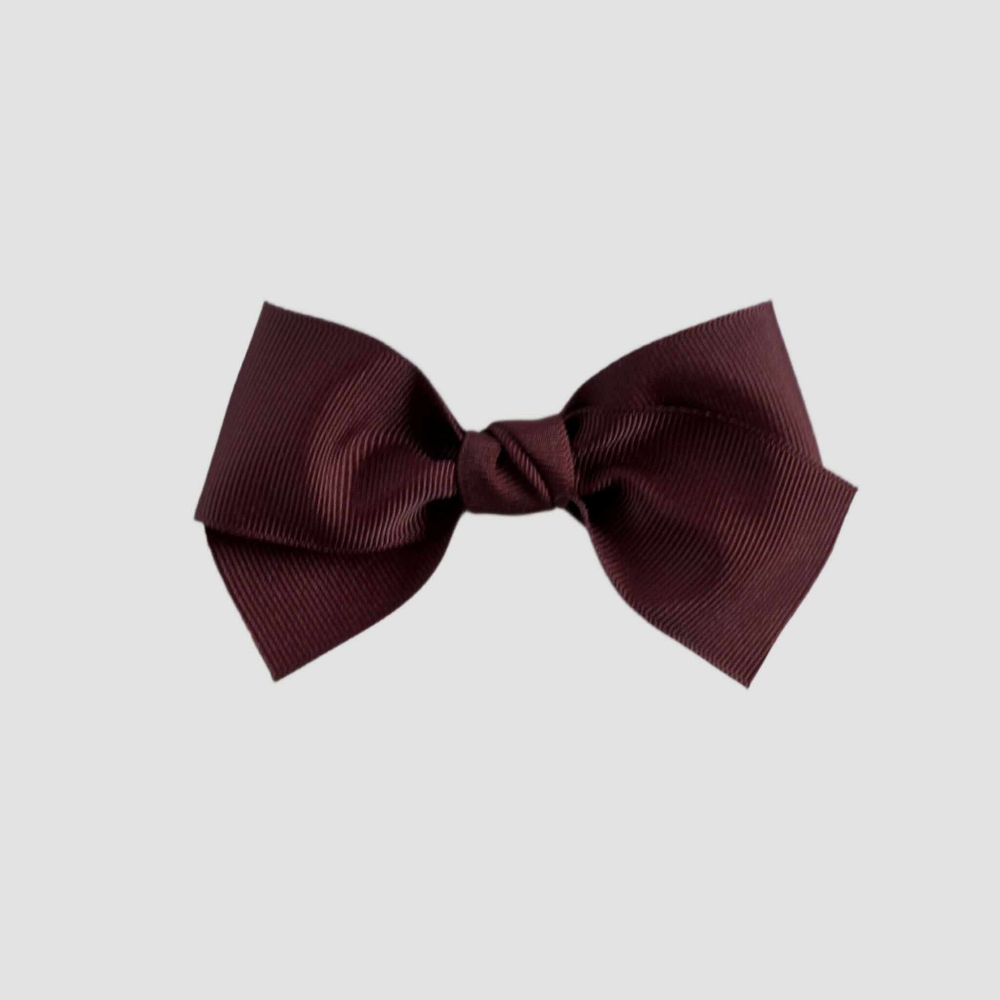Maroon hair bow on a white background