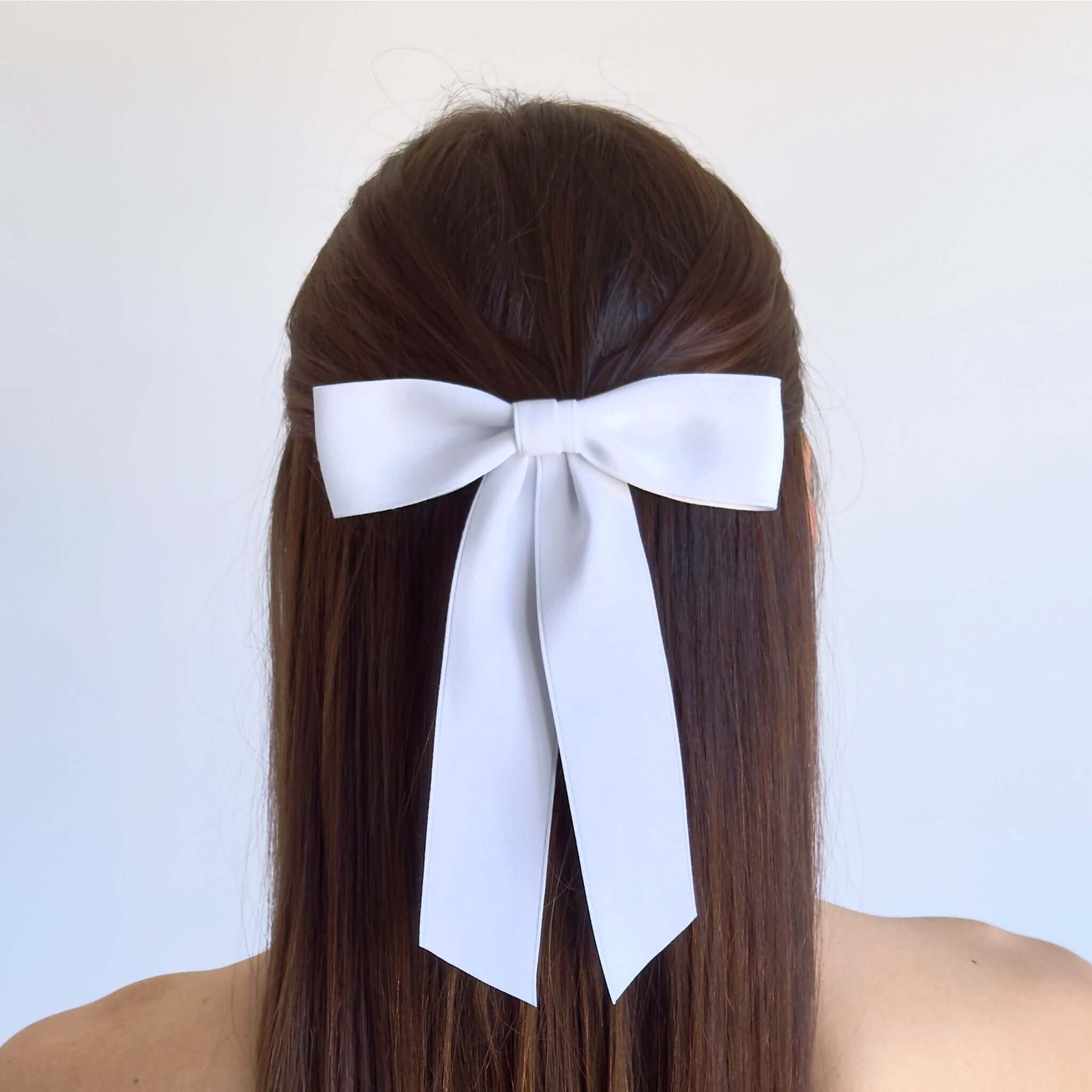 Sustainable recycled matte satin ribbon hair bow elegantly worn for women and girls.