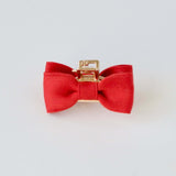 Red satin bow claw clip for everyday wear.
