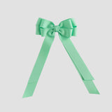Mint green bow on a white background