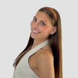 Woman with long brown hair wearing a 1 inch Hannah headband in coffee brown against a white background
