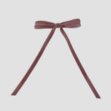 Olivia velvet hair bow in dusty rose pink on a white background