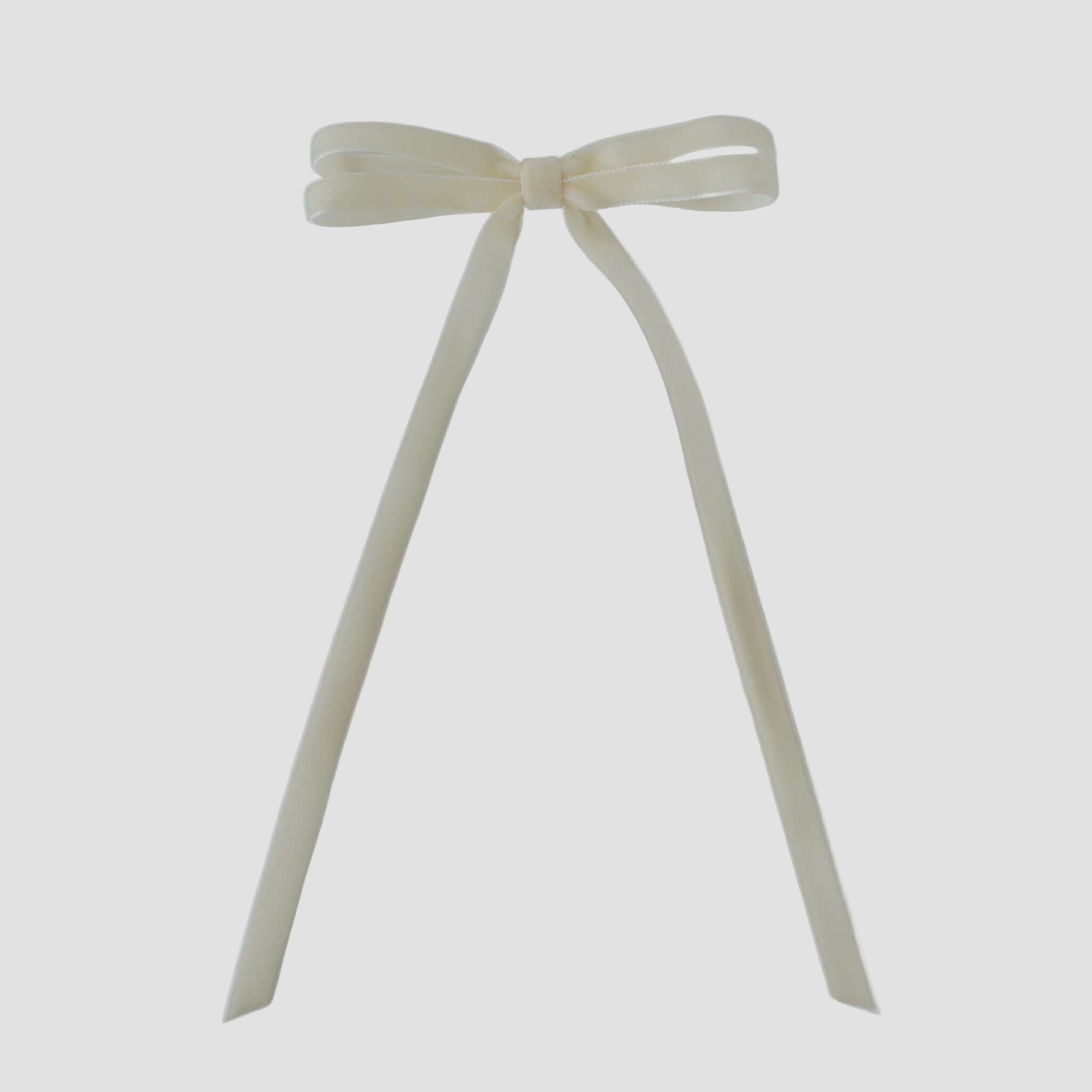 Olivia velvet hair bow in ivory on a white background