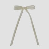 Olivia velvet hair bow in ivory on a white background