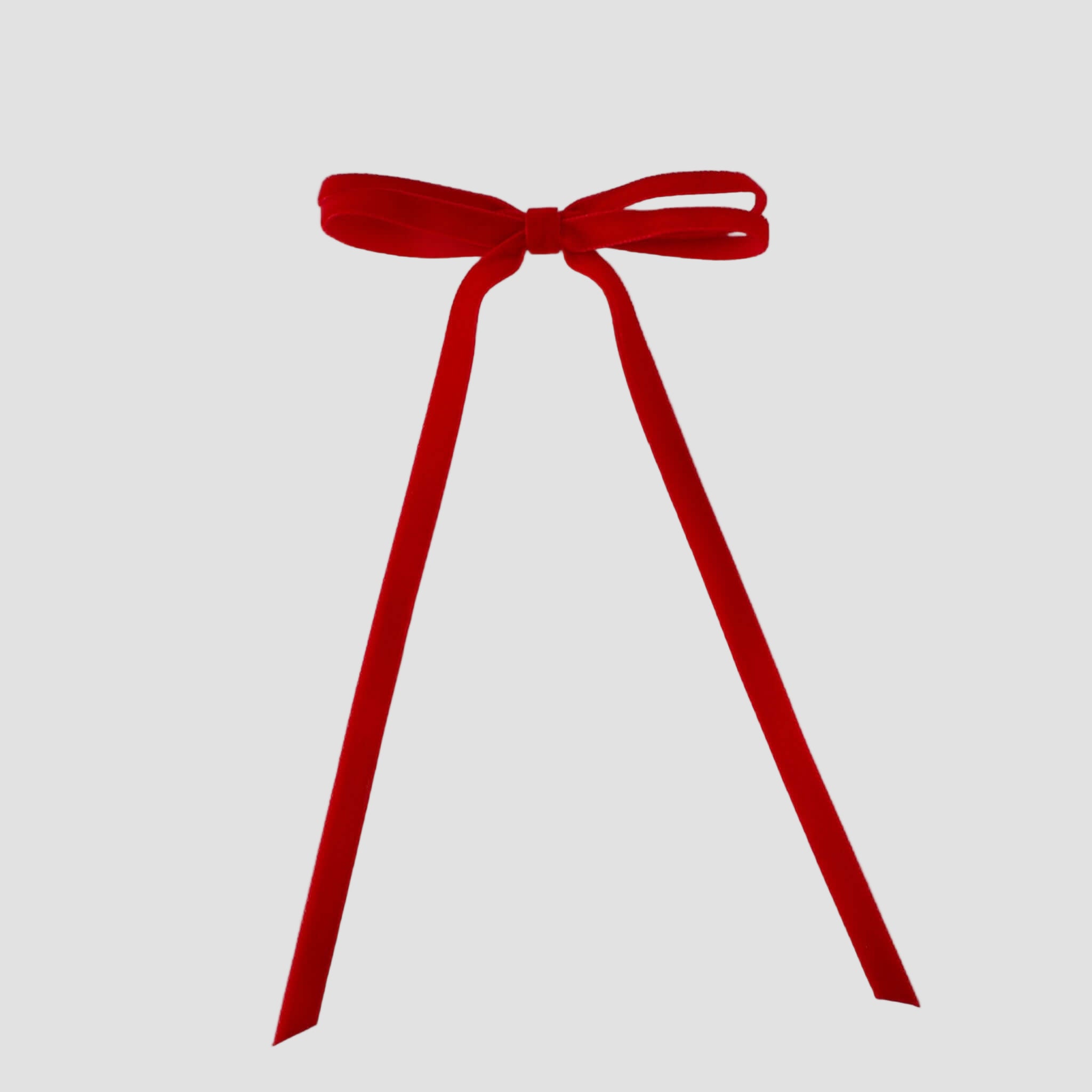 Olivia velvet hair bow in red on a white background