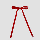Olivia velvet hair bow in red on a white background