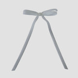 Olivia velvet hair bow in white on a white background