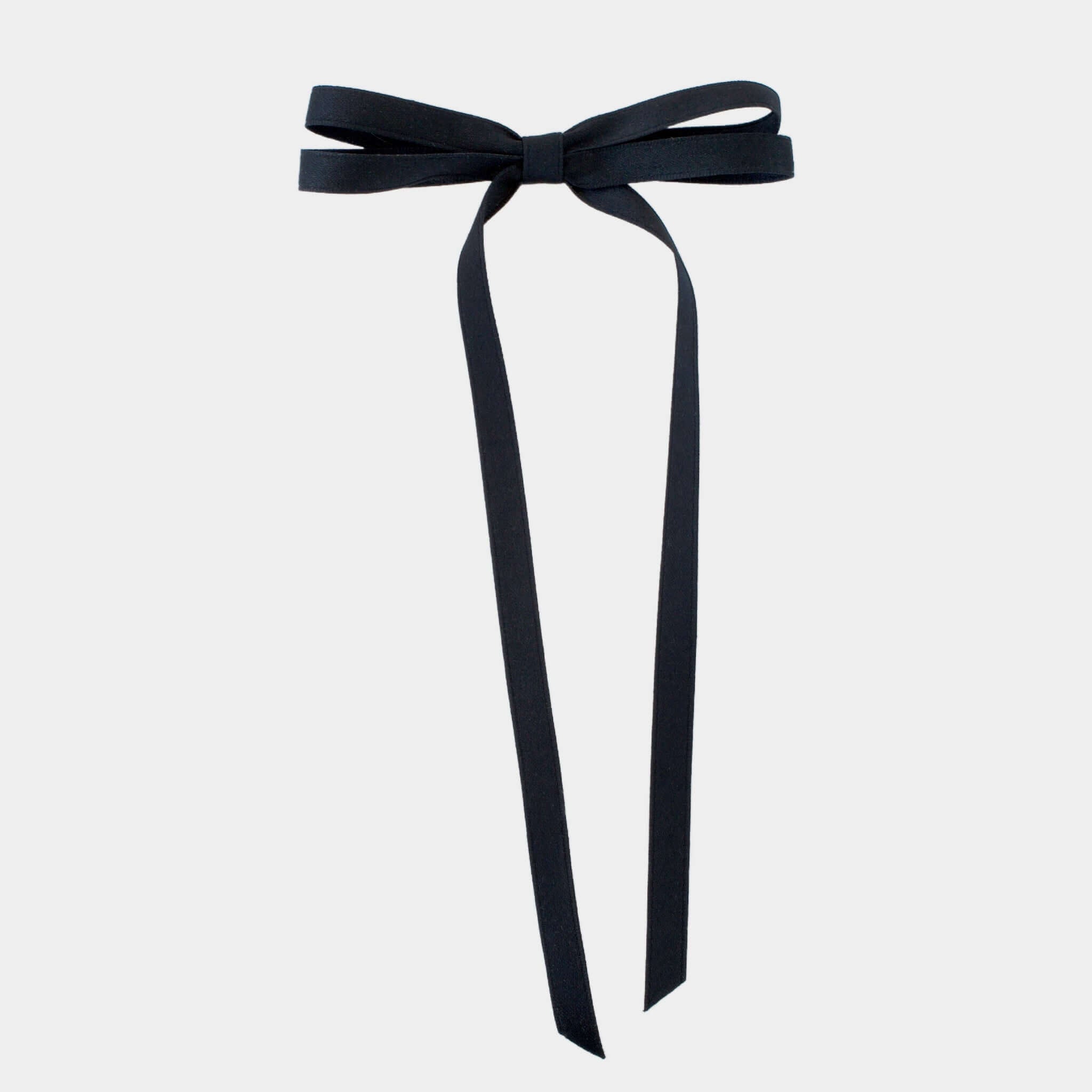 Olivia Matte Satin Bow in black, handcrafted with sustainable recycled ribbon for stylish hair accessorizing.