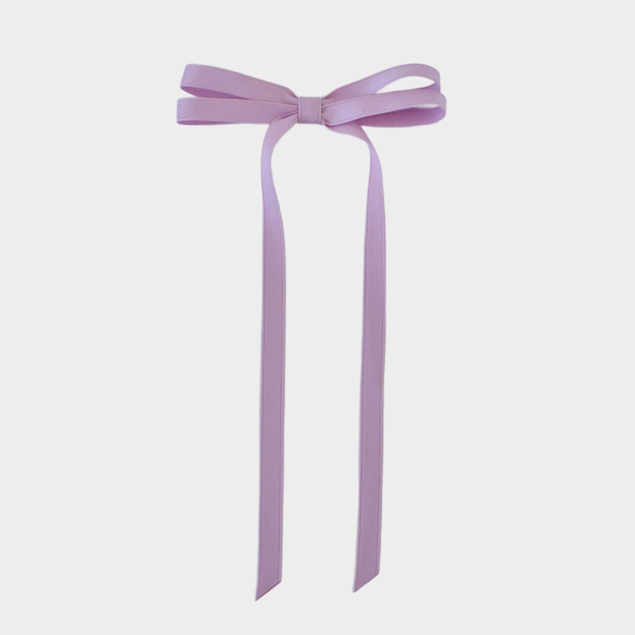 Olivia Matte Satin Bow in lavender, hand crafted with sustainable recycled matte satin ribbon for stylish elegance.