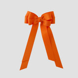 Orange grosgrain emerson bow on a white background