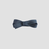 Dark gray bow on a white background