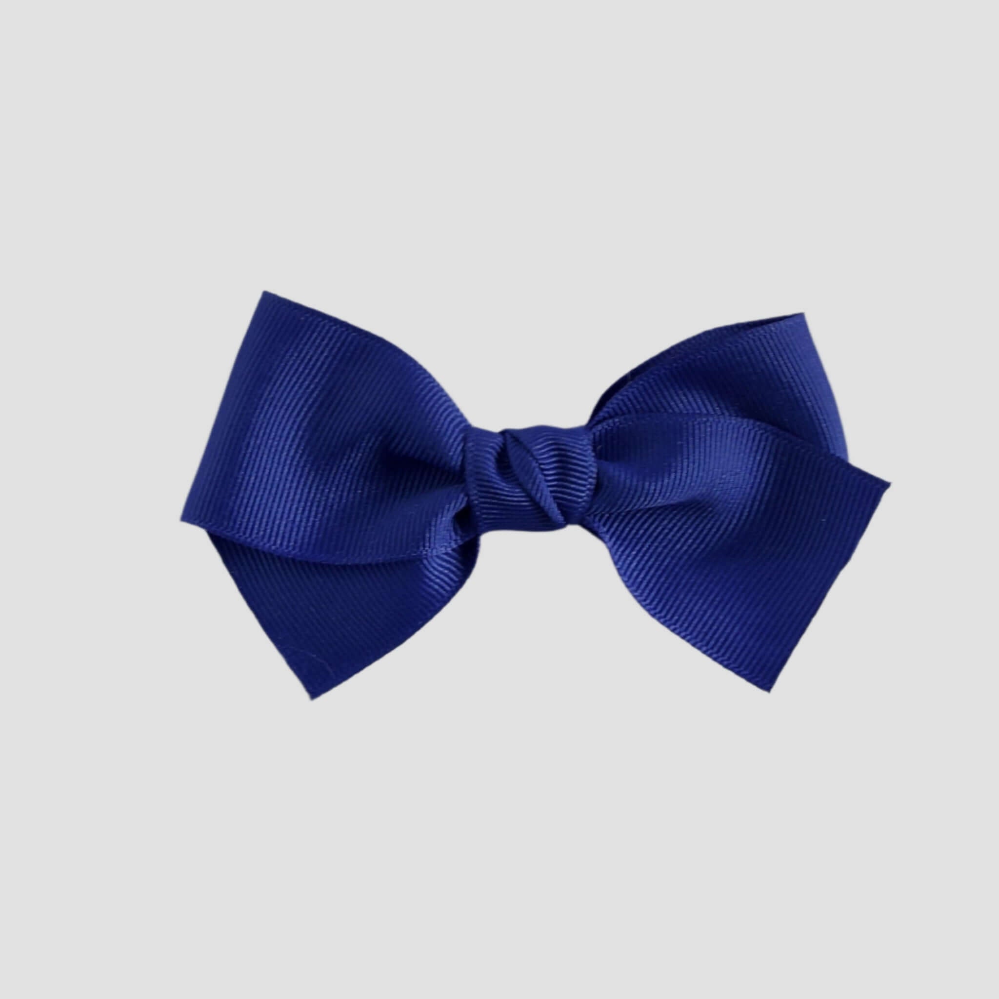 Royal blue bow on a white background