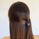 Vintage-inspired hair bow on gold claw clip