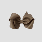 Taupe brown hair bow on a white background
