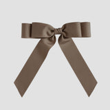 Taupe brown bow on a white background