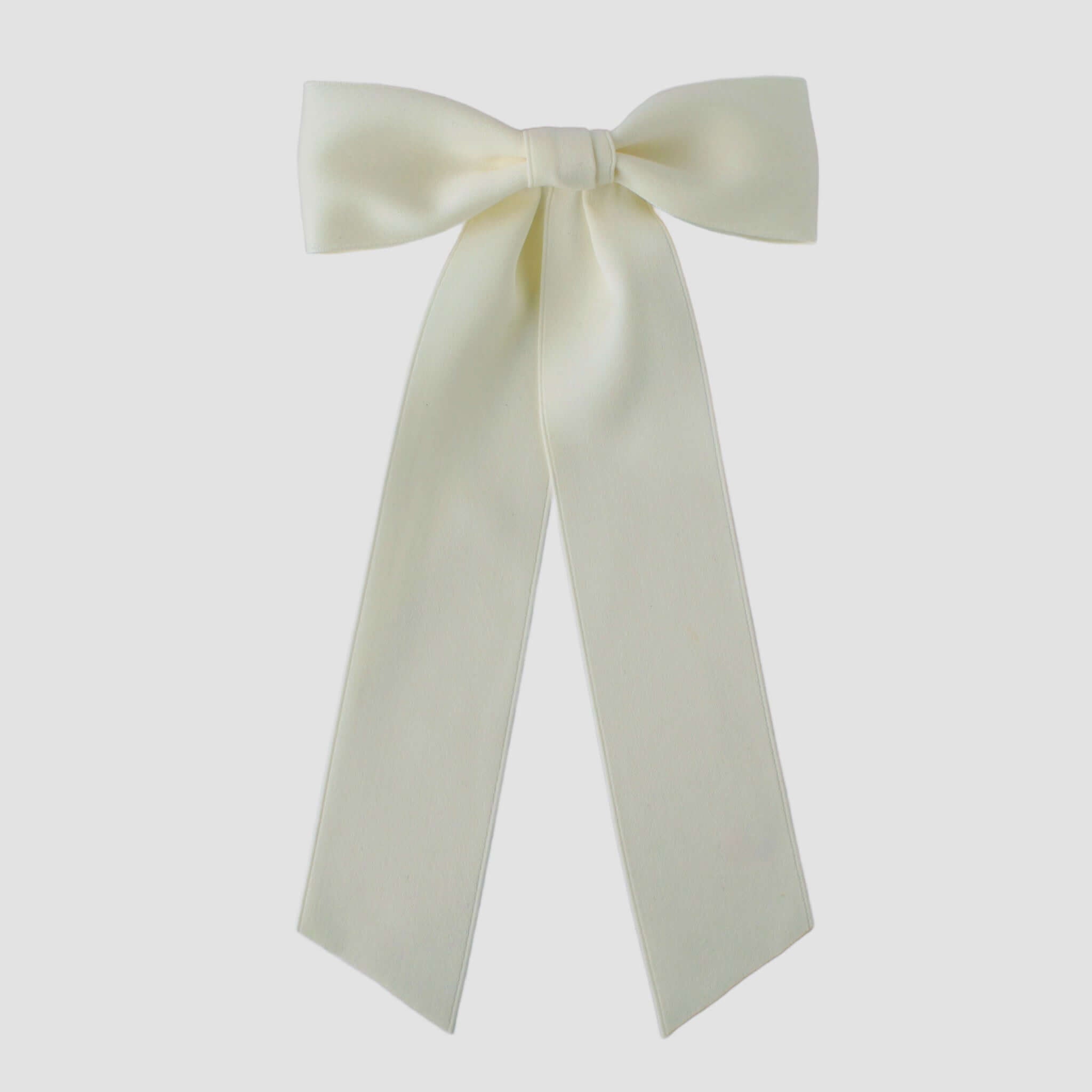 Zoe Matte Satin Bow in ivory, oversized long tail hair bow handmade with sustainable recycled matte satin ribbon for wedding and everyday wear.
