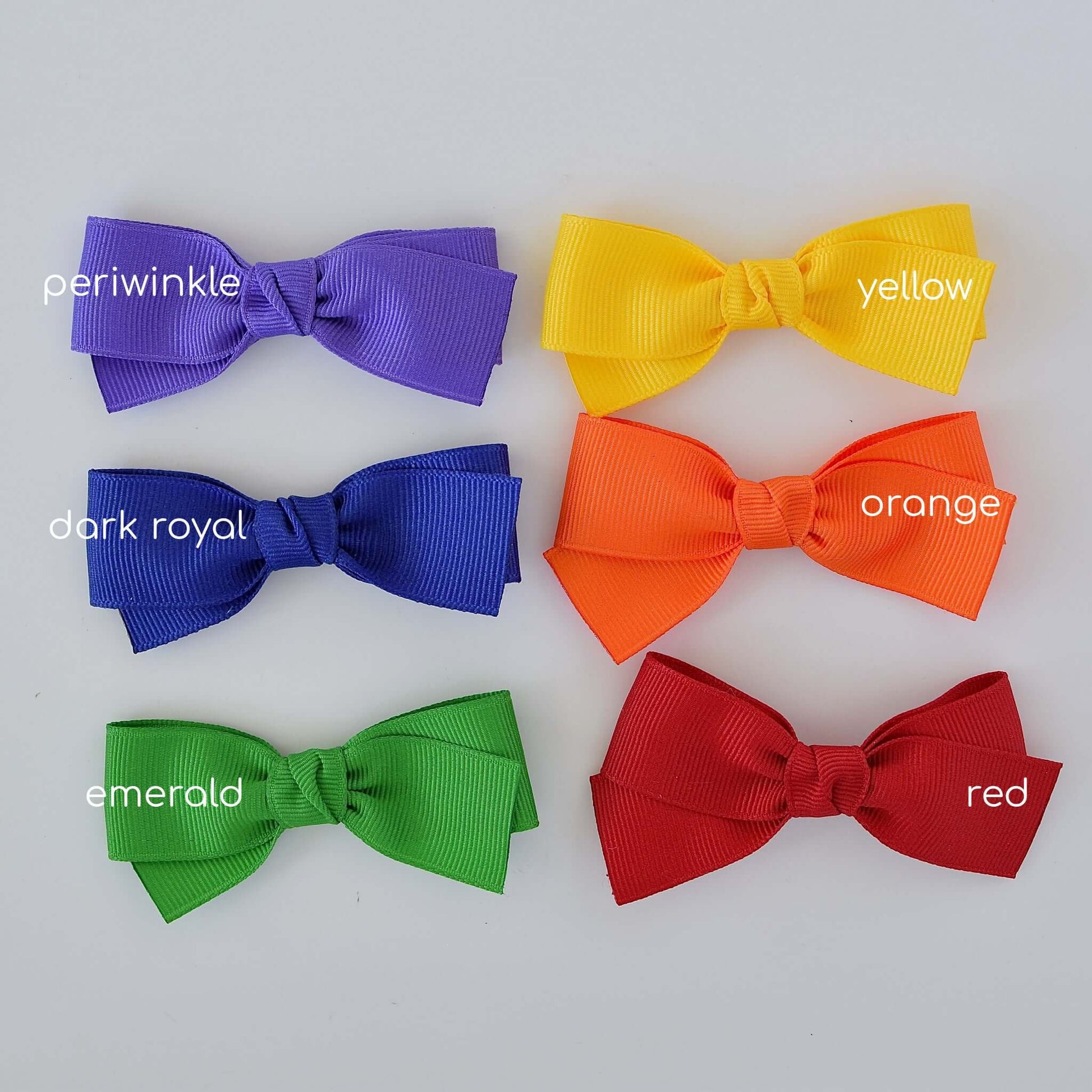 3 inch grosgrain baby Kayla bow clips in periwinkle, yellow, dark royal, orange, emerald, and red colors.