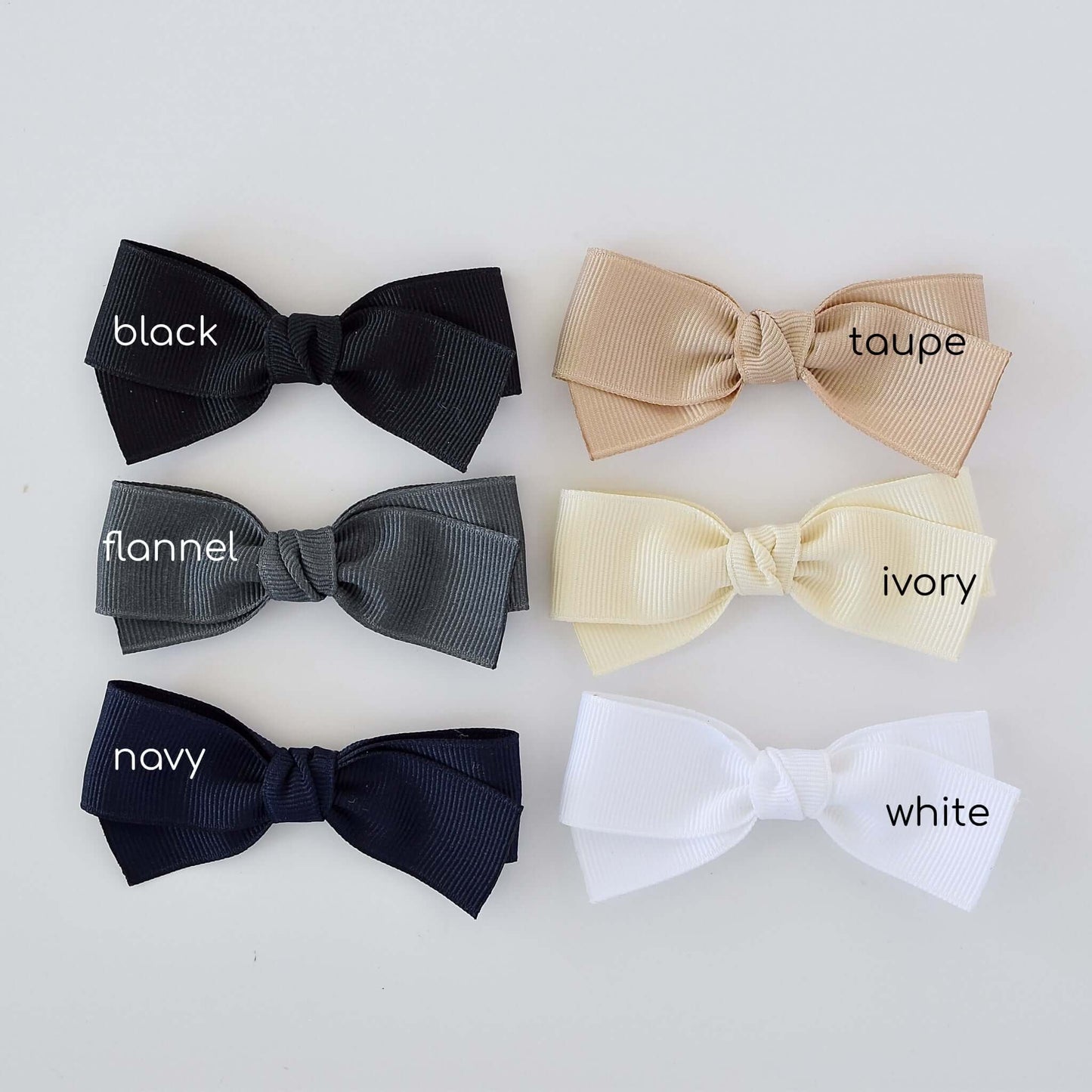 3 inch grosgrain baby Kayla bow clips and headbands in black, taupe, flannel, ivory, navy, and white colors.