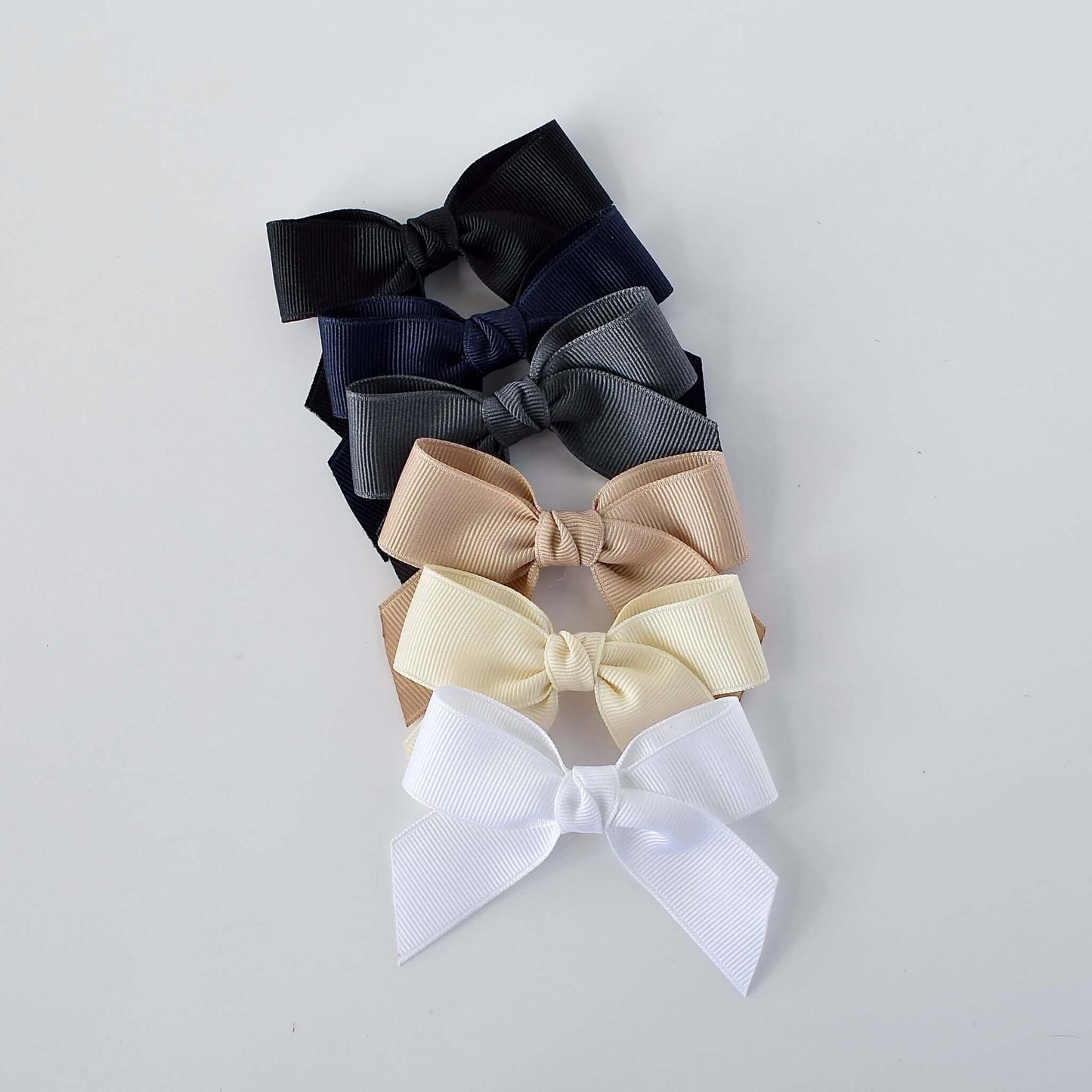 Assorted 3 inch grosgrain sailor bow clips in black, gray, navy, taupe, ivory, and white for babies, toddlers, and little girls
