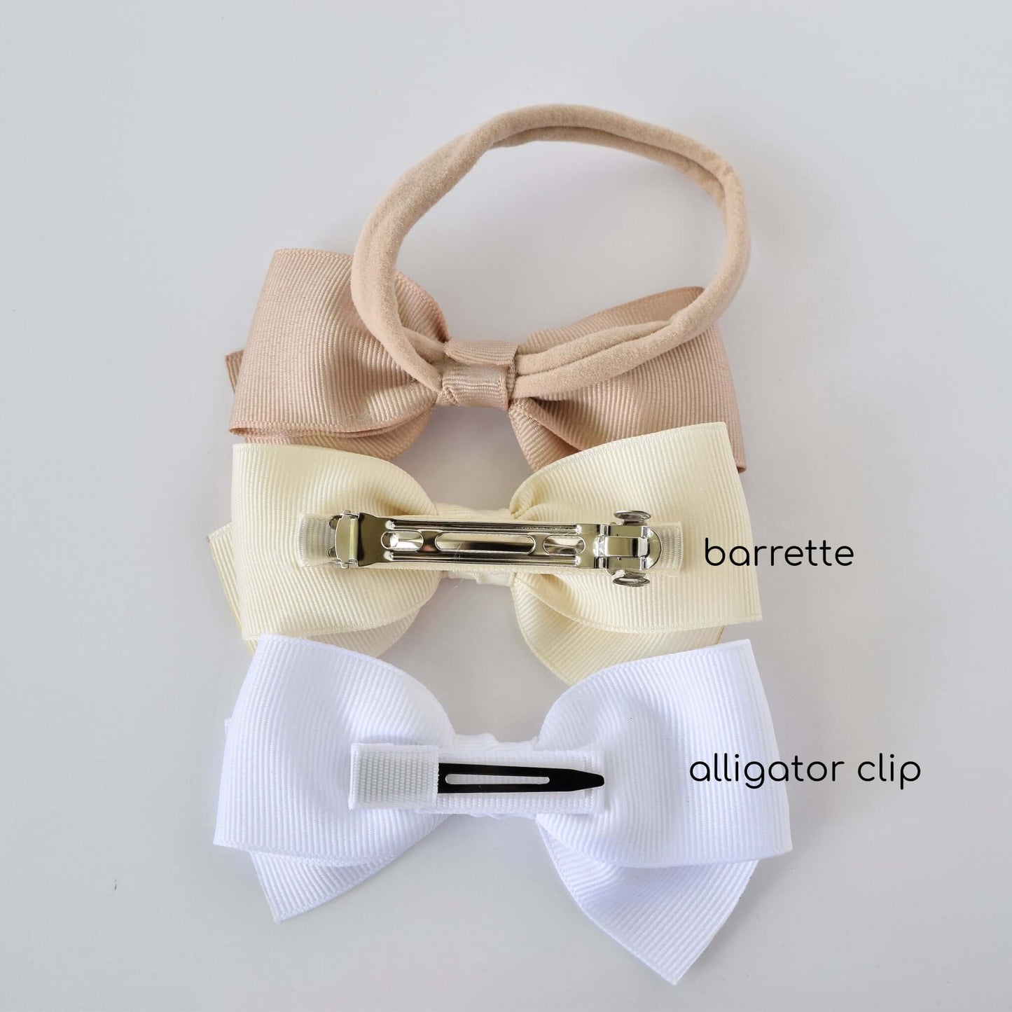 Grosgrain baby Kayla bow clip and headband with alligator clip and barrette options for toddlers and newborns in pastel colors.