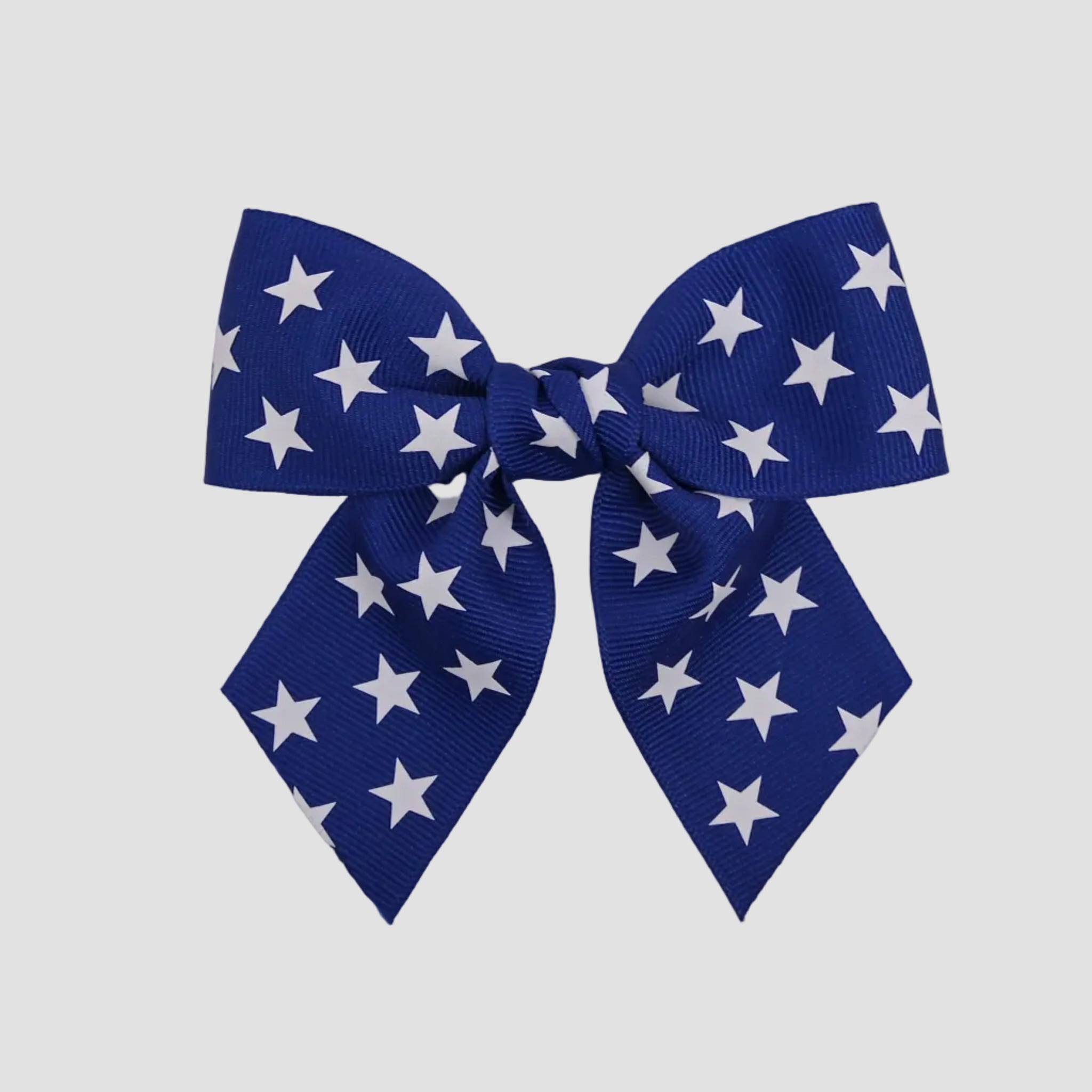 Royal blue 4 inch sailor bow with white stars on a white background