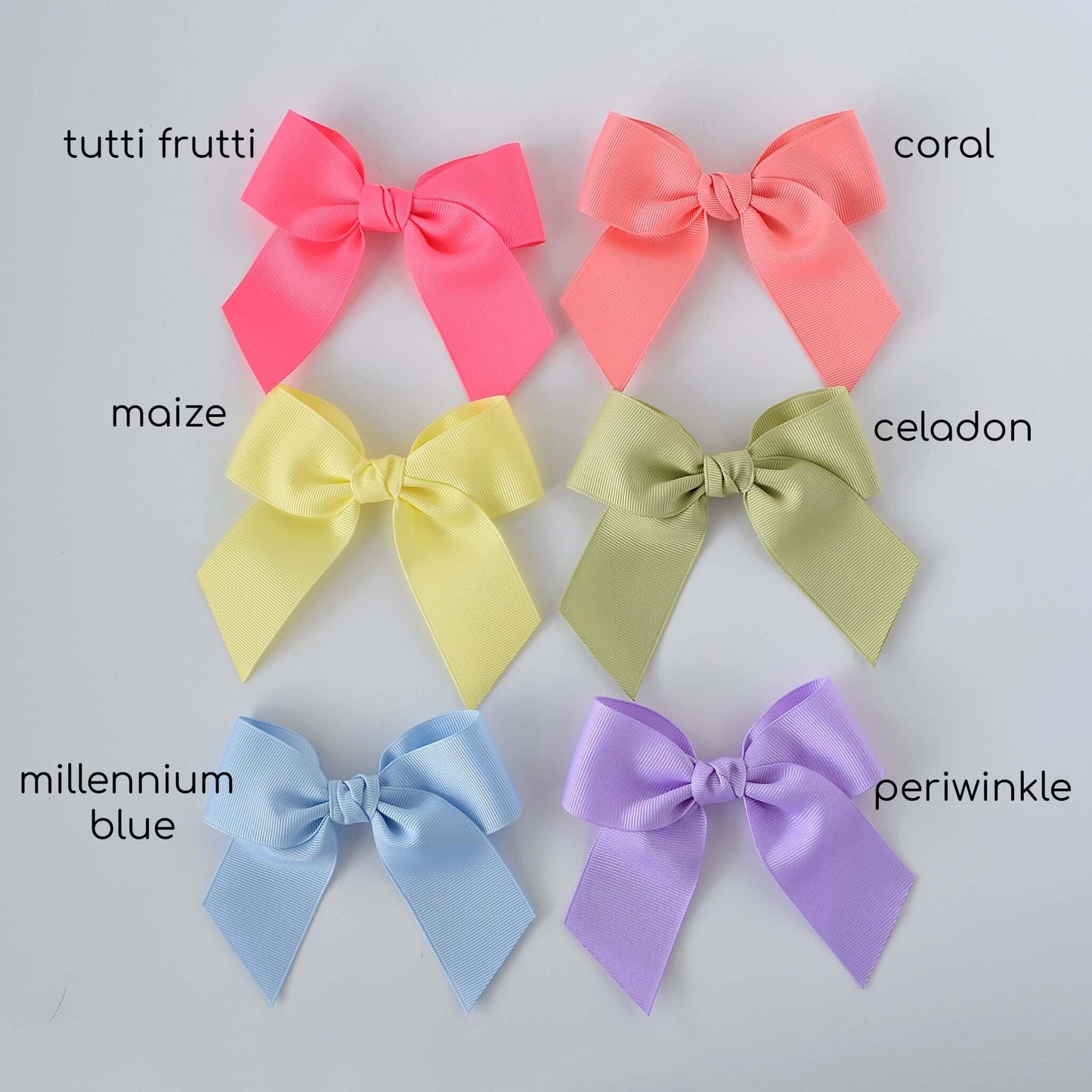 Six 4 inch grosgrain Sailor hair bows in pastel colors: tutti frutti, coral, maize, celadon, millennium blue, and periwinkle.