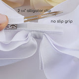 Alligator clip with white ribbon and text indicating size and feature