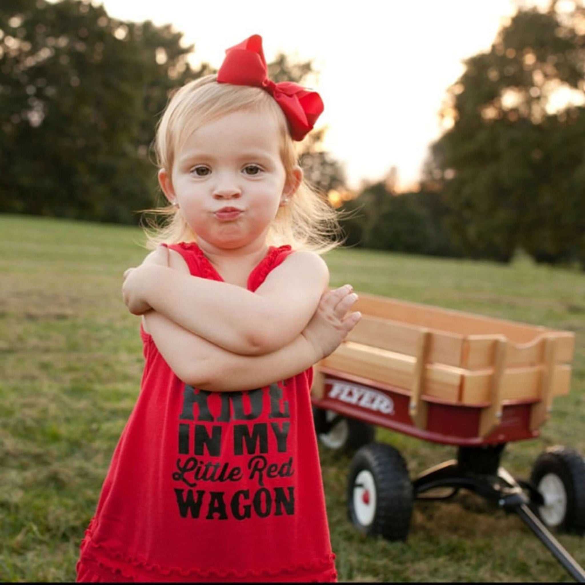 Little Girl wearing 5 inch Penelope bow headband in red,