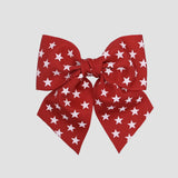 5 inch sailor bow in red bow with white star on a white background