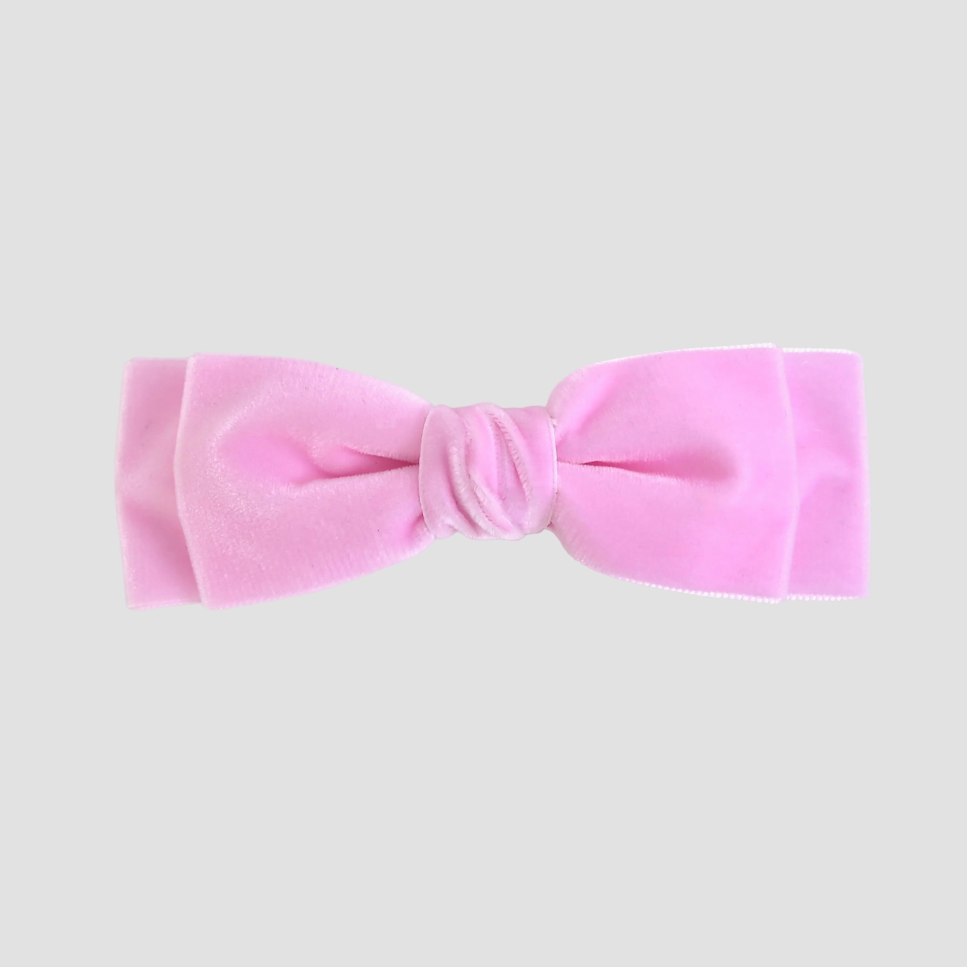Light Pink Ave velvet bow on a white background