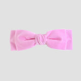 Light Pink Ave velvet bow on a white background