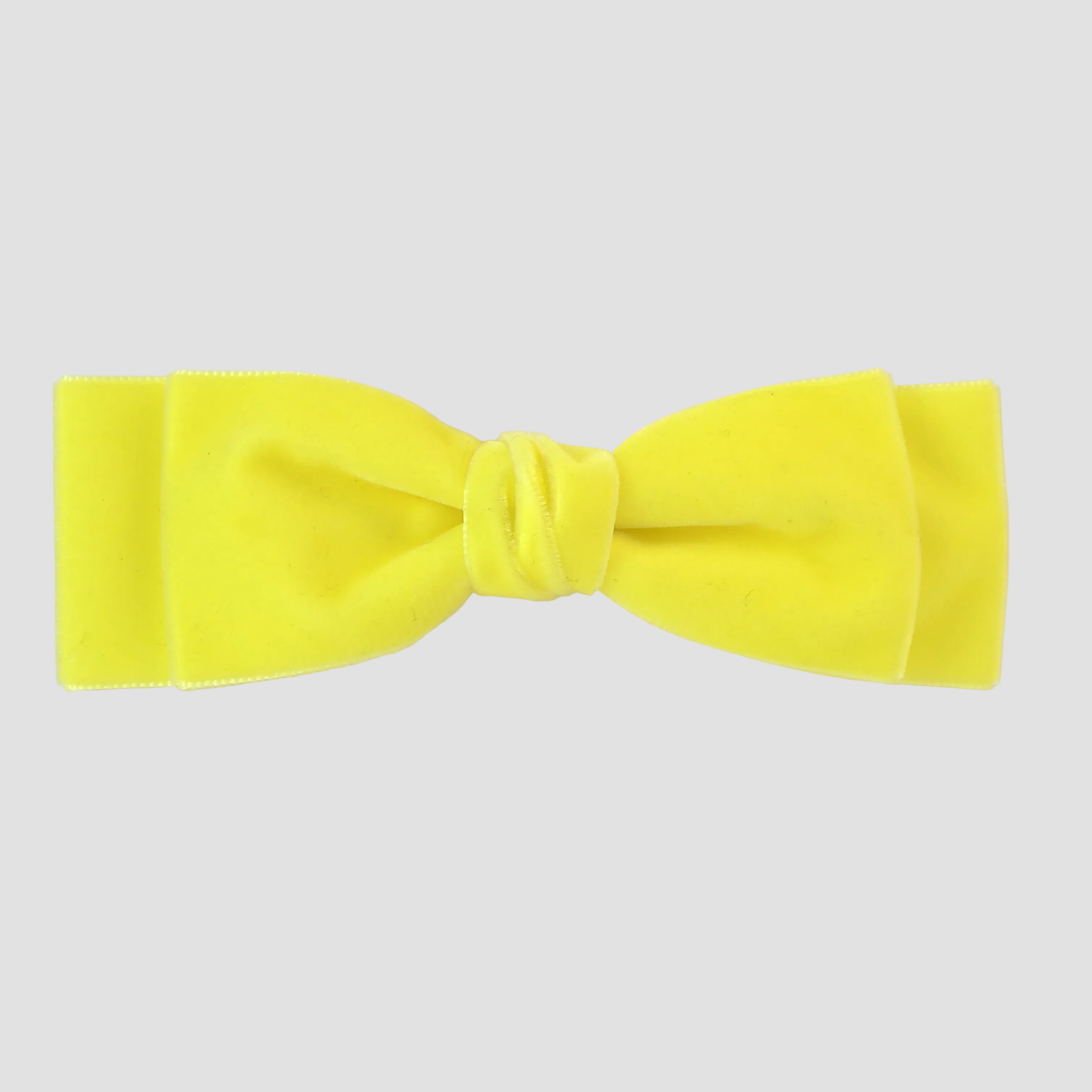 Ava bow in yellow on a white background