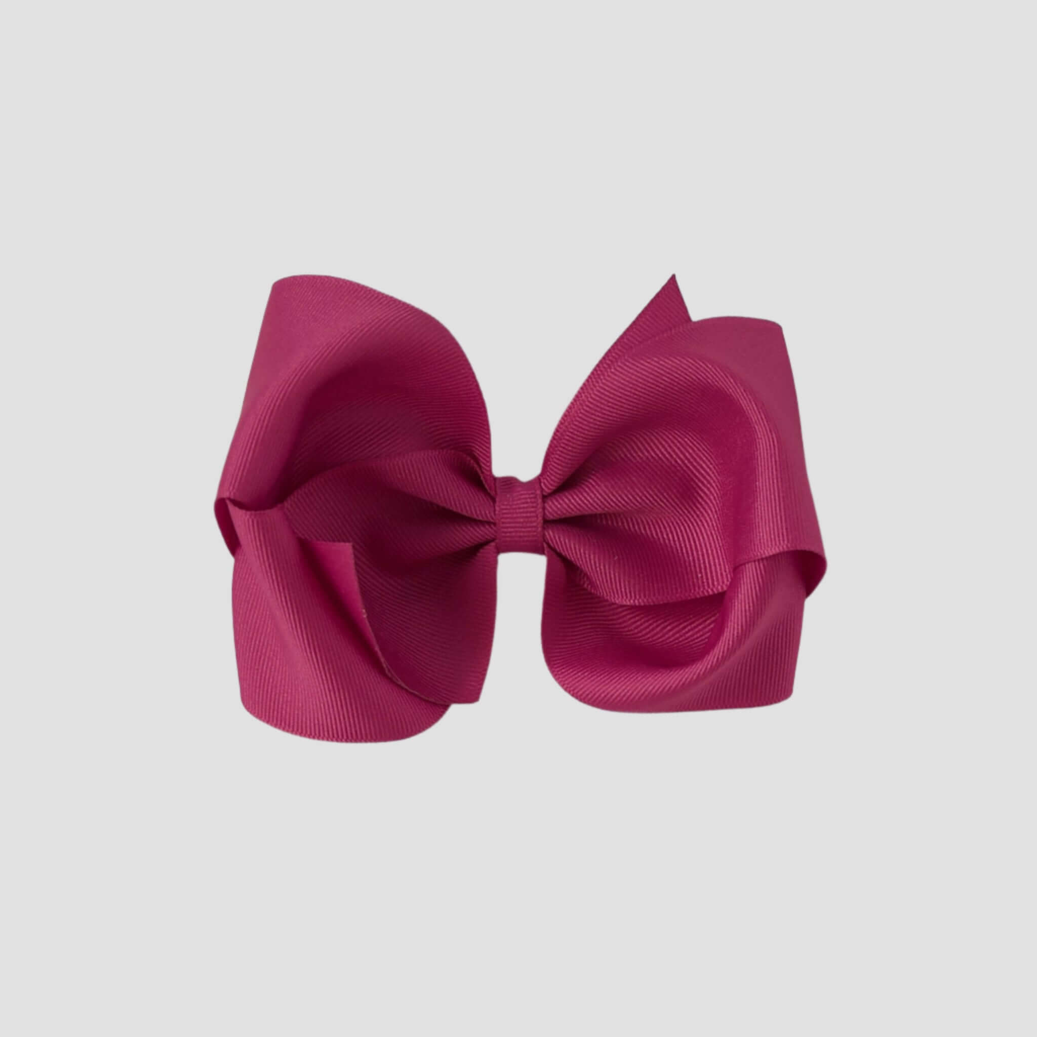 Azalea pink hair bow on a white background