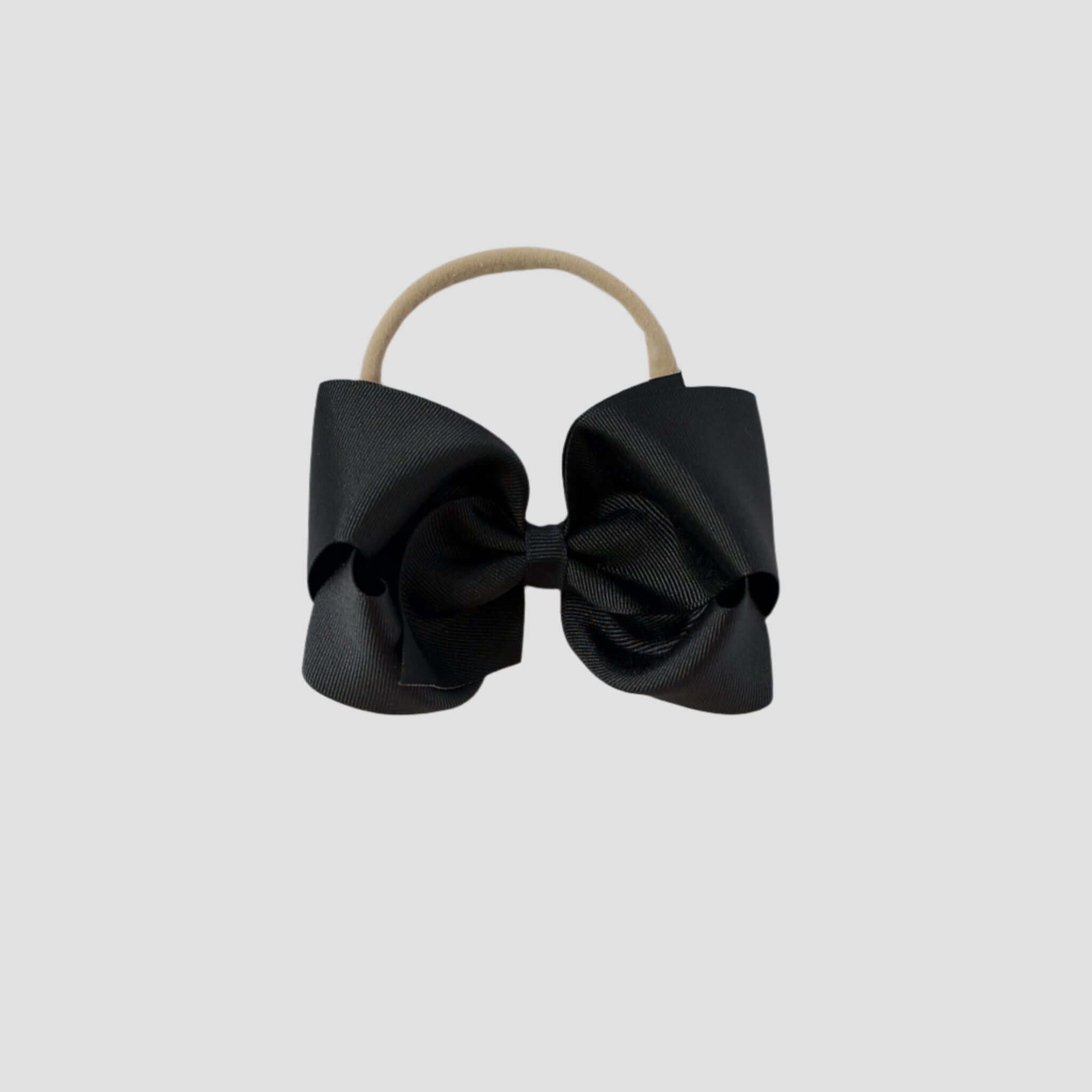 5 inch Grosgrain Penelope hair bow Headband in Black on a white background