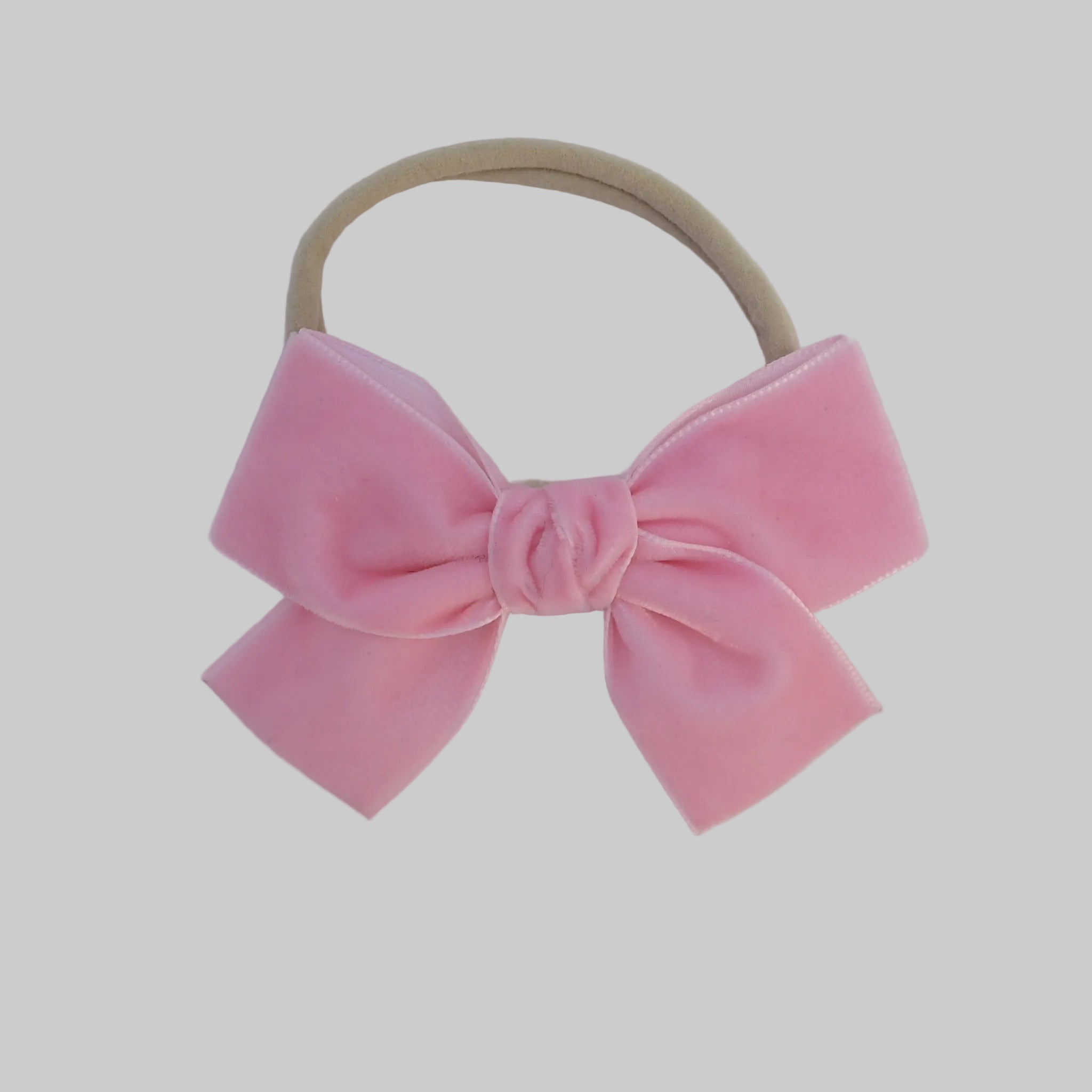 blush Kayla velvet hair bow headband for baby girl.