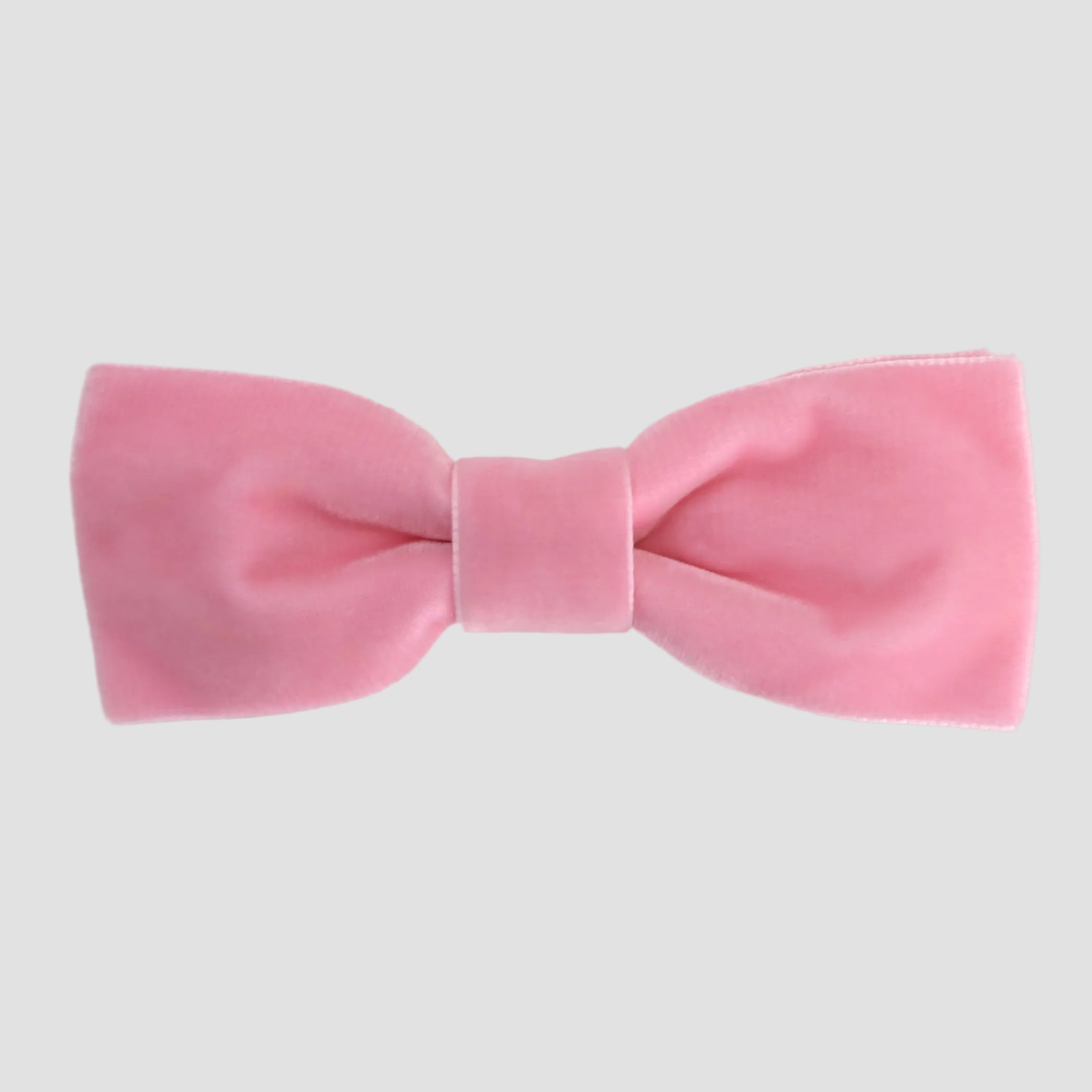 Blush pink men bow tie on a white background.