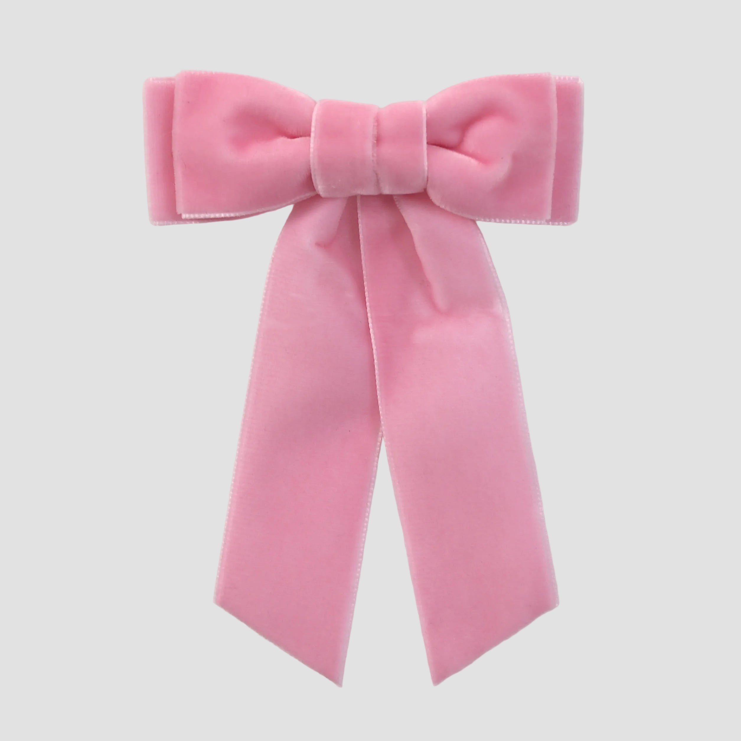 Blush pink velvet Mia bow on a white background