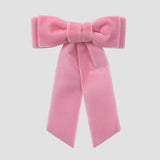 Blush pink velvet Mia bow on a white background