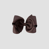 Brown hair bow on a white background