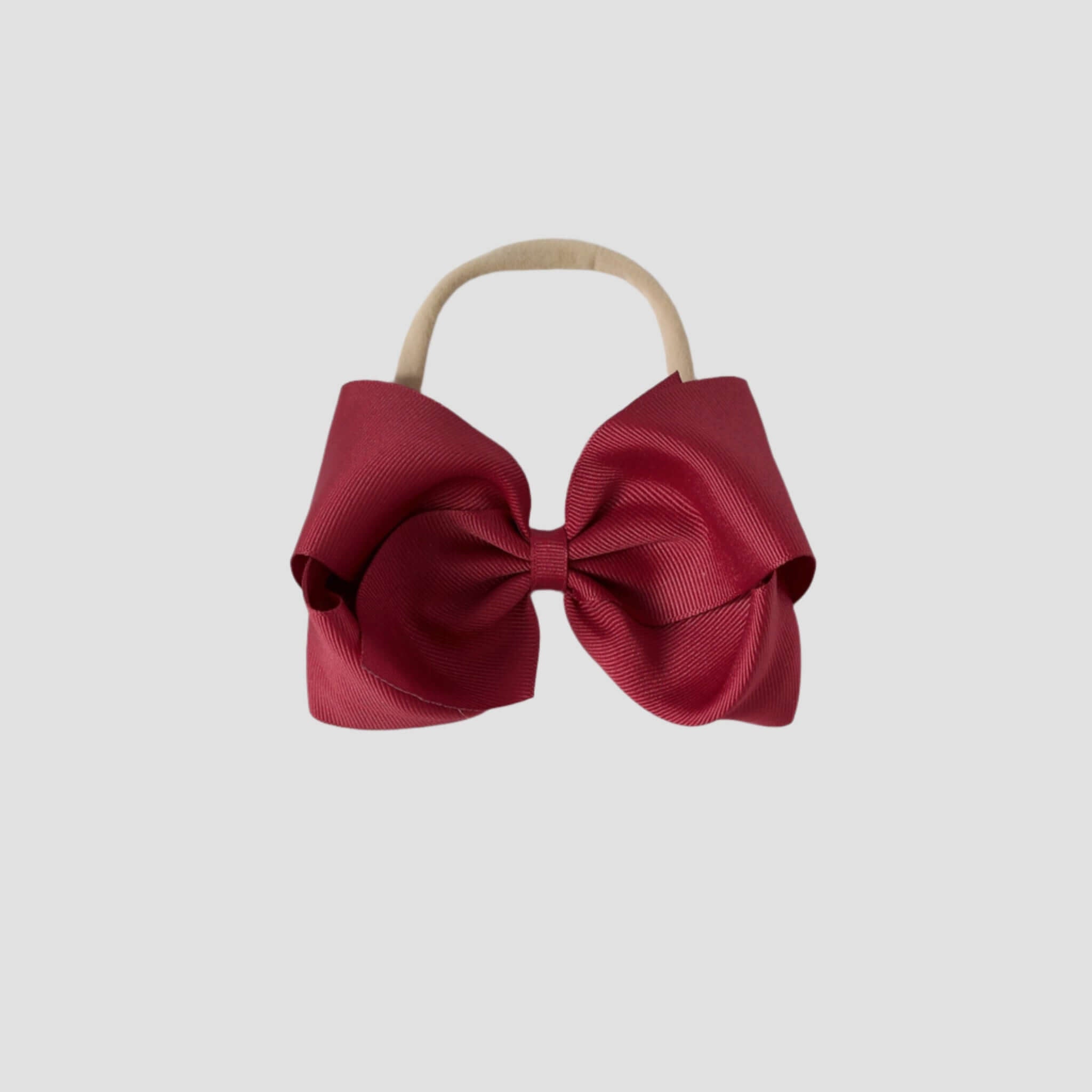 5 inch Grosgrain Penelope hair bow Headband in cranberry red on a white background