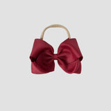 5 inch Grosgrain Penelope hair bow Headband in cranberry red on a white background