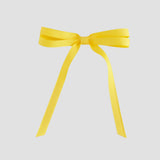 Yellow grosgrain ribbon bow on a white background