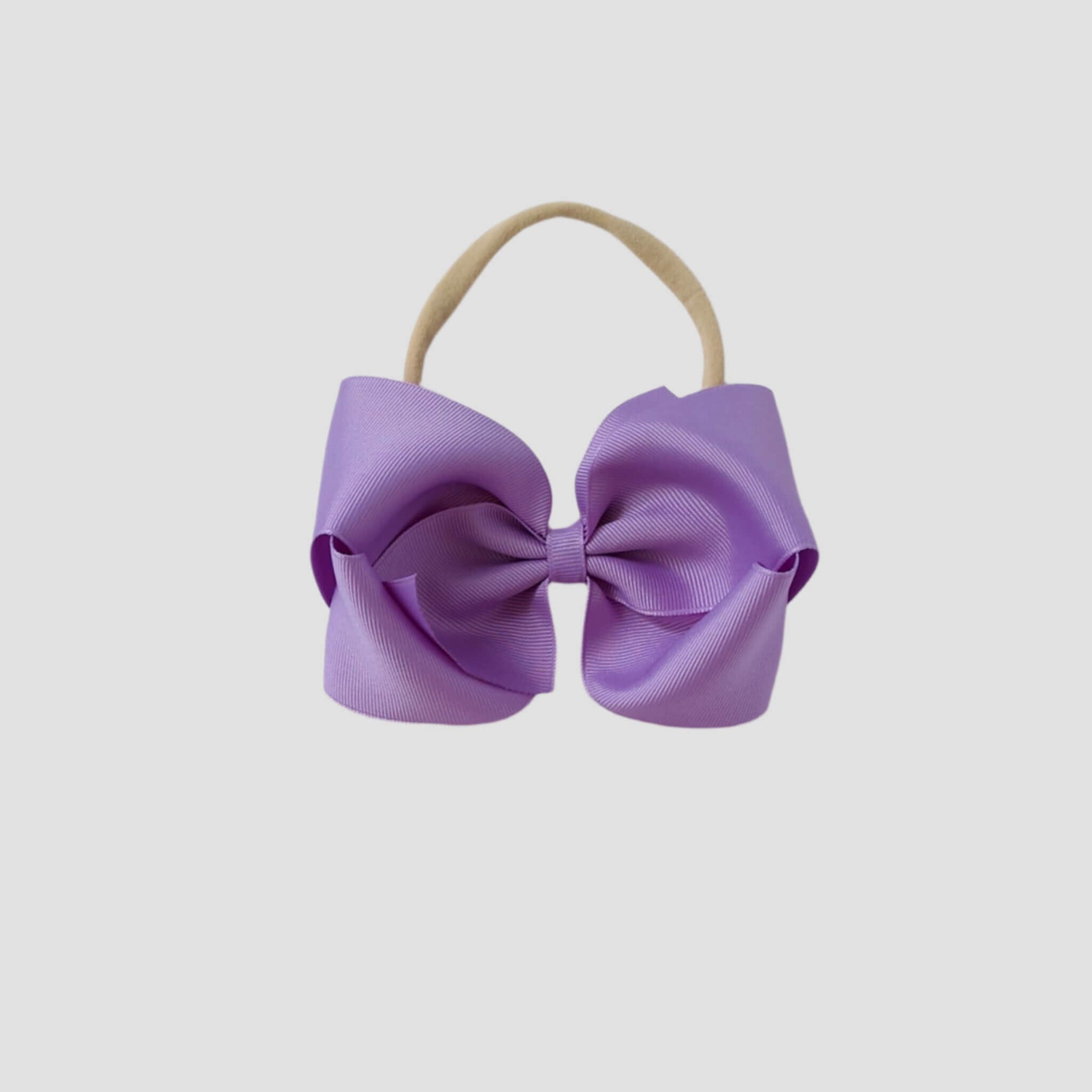 5 inch Grosgrain Penelope hair bow Headband in dark orchid purple on a white background