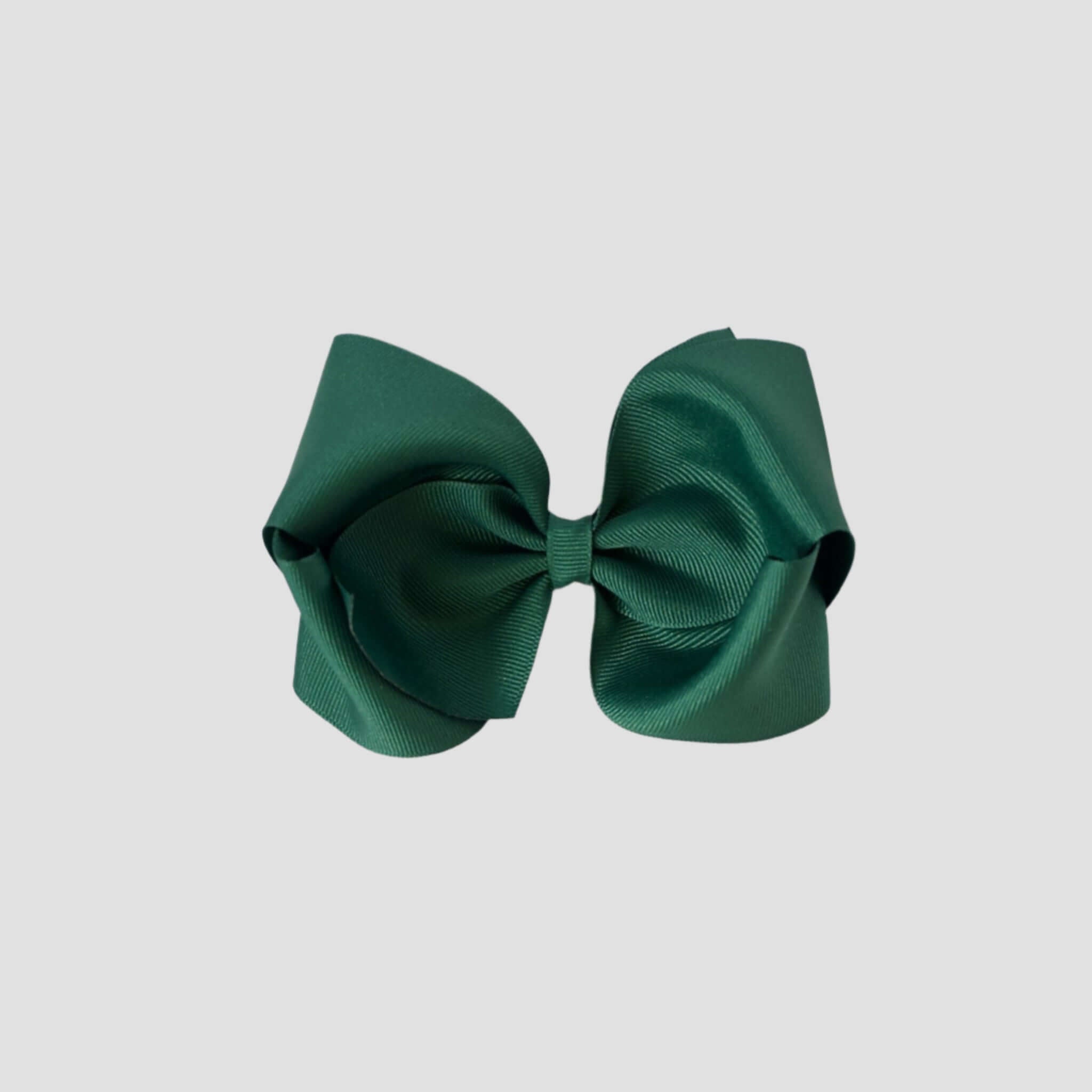 Forest g reen hair bow on a white background